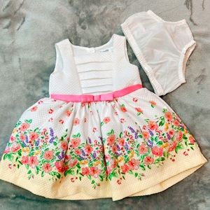 White tulle dress for infant with colorful floral arrangements. 3-6 Months.